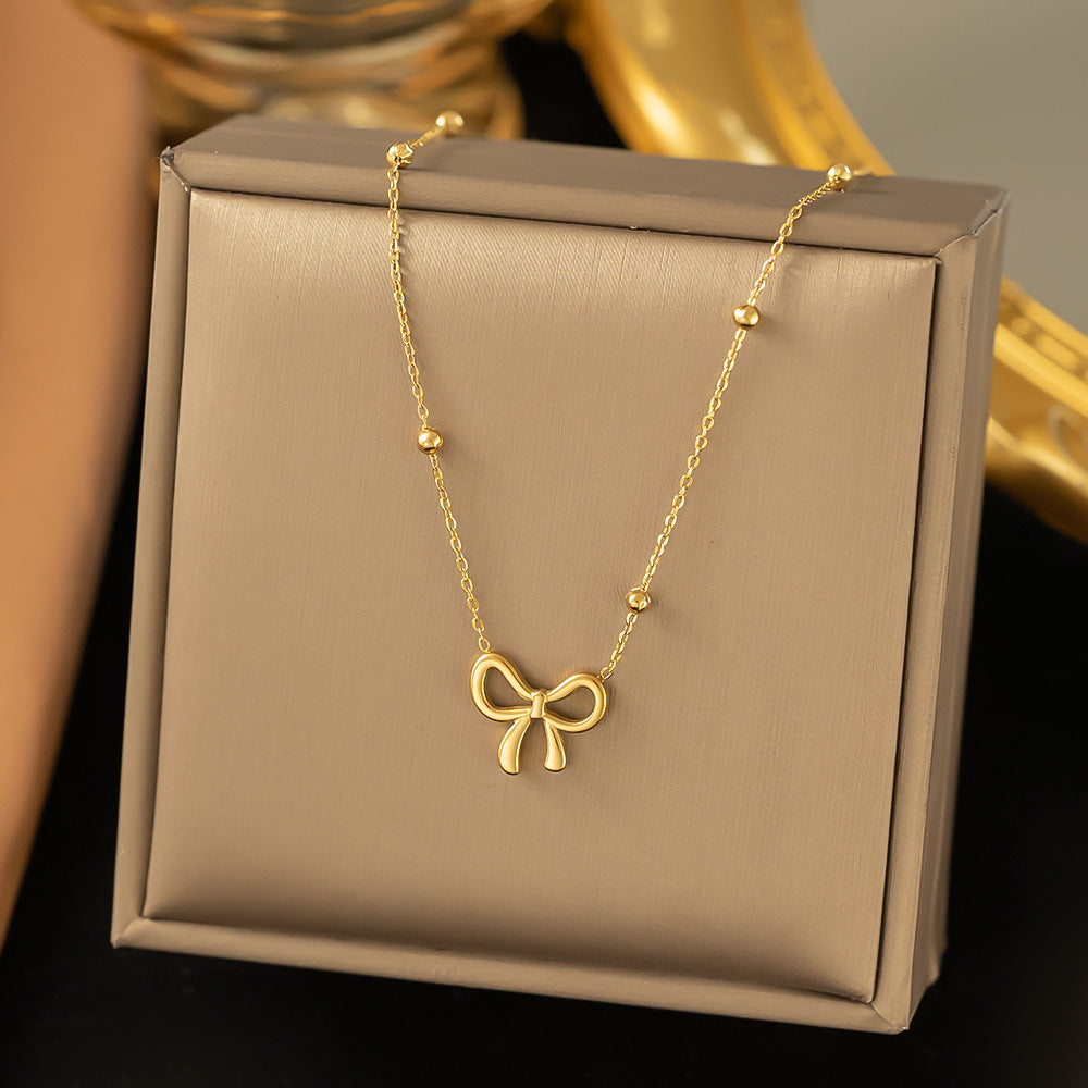 Minimal Gold Bow Pendant